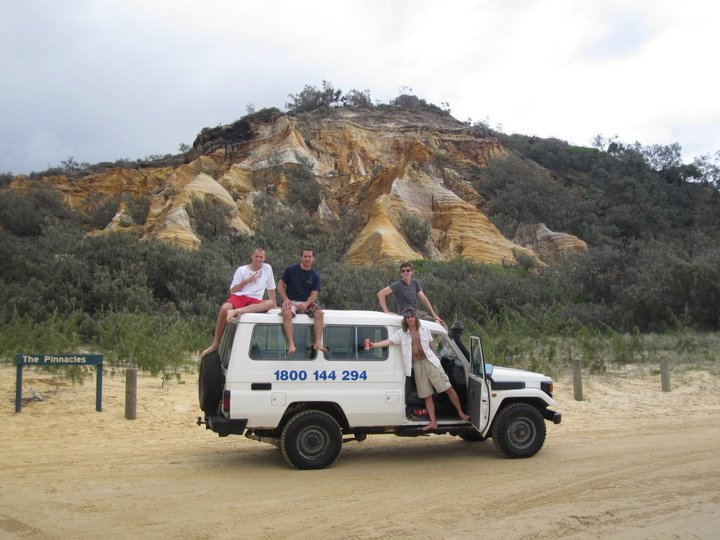 The boys sitting on the 4x4