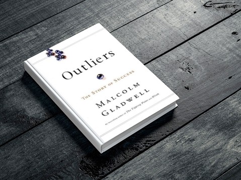 Outliers book on a table
